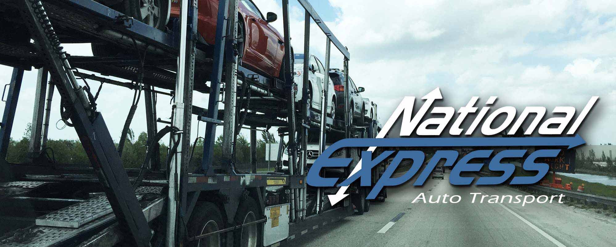 Open car carrier transport with company logo