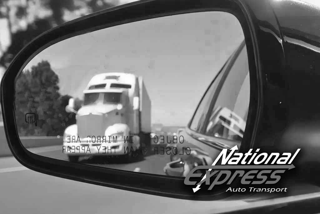 auto transport truck in rear view black and white