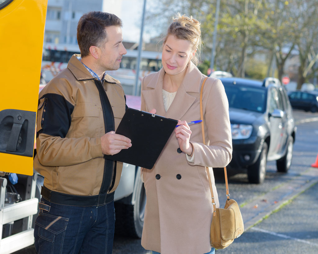 auto buyer going over shipping contract