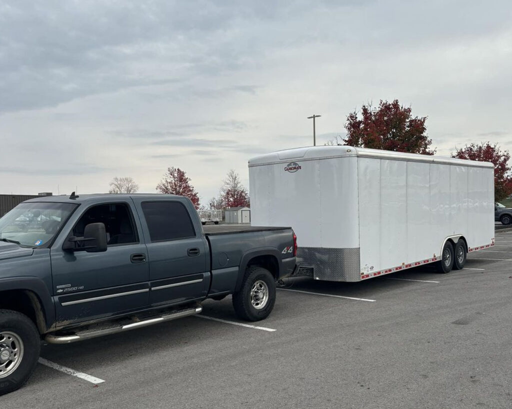 enclosed truck transport in parking lot